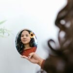 woman holding a mirror