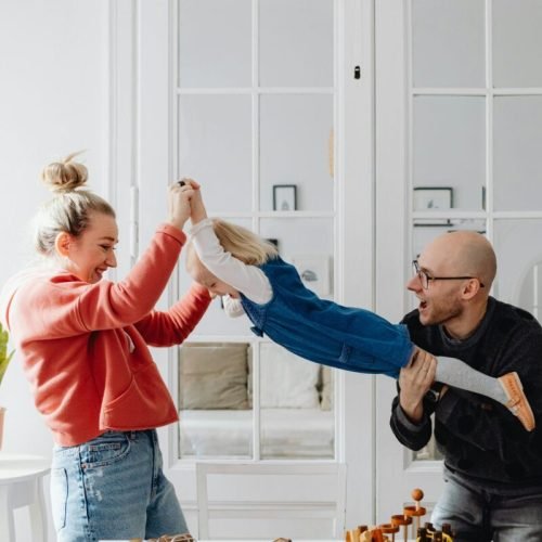 Photo by Karolina Grabowska: https://www.pexels.com/photo/a-man-and-woman-carrying-their-daughter-while-having-fun-7296760/