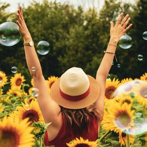 Photo by Andre Furtado on <a href="https://www.pexels.com/photo/woman-surrounded-by-sunflowers-1263986/" rel="nofollow">Pexels.com</a>