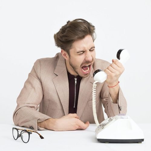 Photo by Moose Photos on <a href="https://www.pexels.com/photo/man-wearing-brown-suit-jacket-mocking-on-white-telephone-1587014/" rel="nofollow">Pexels.com</a>