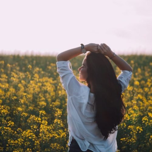 Photo by Bela cheers on <a href="https://www.pexels.com/photo/woman-standing-near-yellow-flowers-1892512/" rel="nofollow">Pexels.com</a>