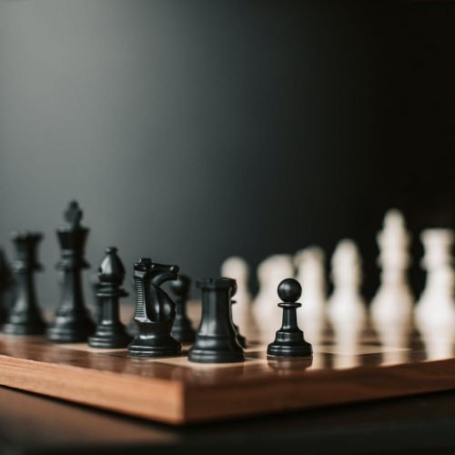 Photo by Vlada Karpovich on <a href="https://www.pexels.com/photo/black-and-white-chess-pieces-on-chess-board-6114992/" rel="nofollow">Pexels.com</a>