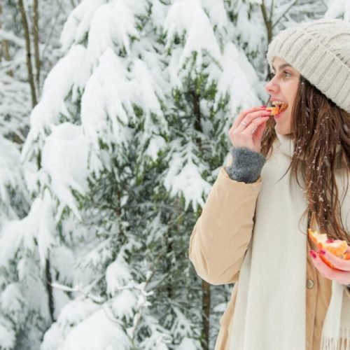 Woman Eating comfort food in Winter