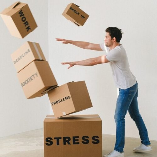 Photo by SHVETS production: https://www.pexels.com/photo/man-falling-carton-boxes-with-negative-words-7203956/